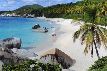 Strolling on the beach at Rosewood Little Dix Bay