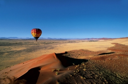 Hot air ballooning over dunes